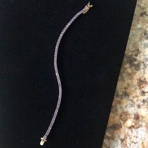 Gold Toned Light Purple Tennis Bracelet. Nice